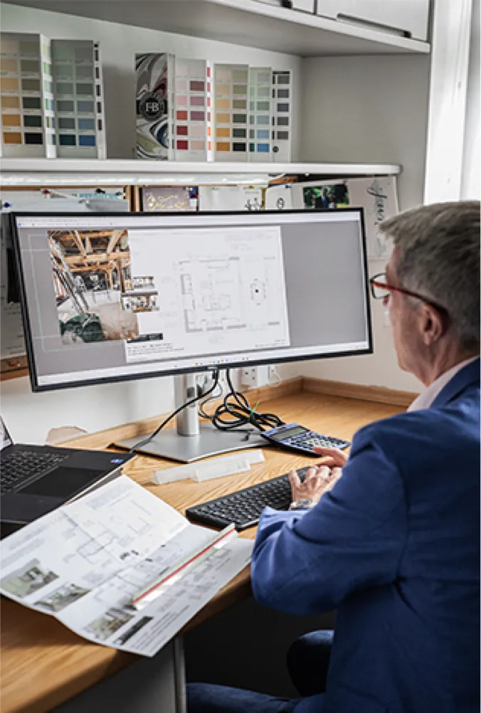 Our kitchen designer working on a kitchen plan at his computer