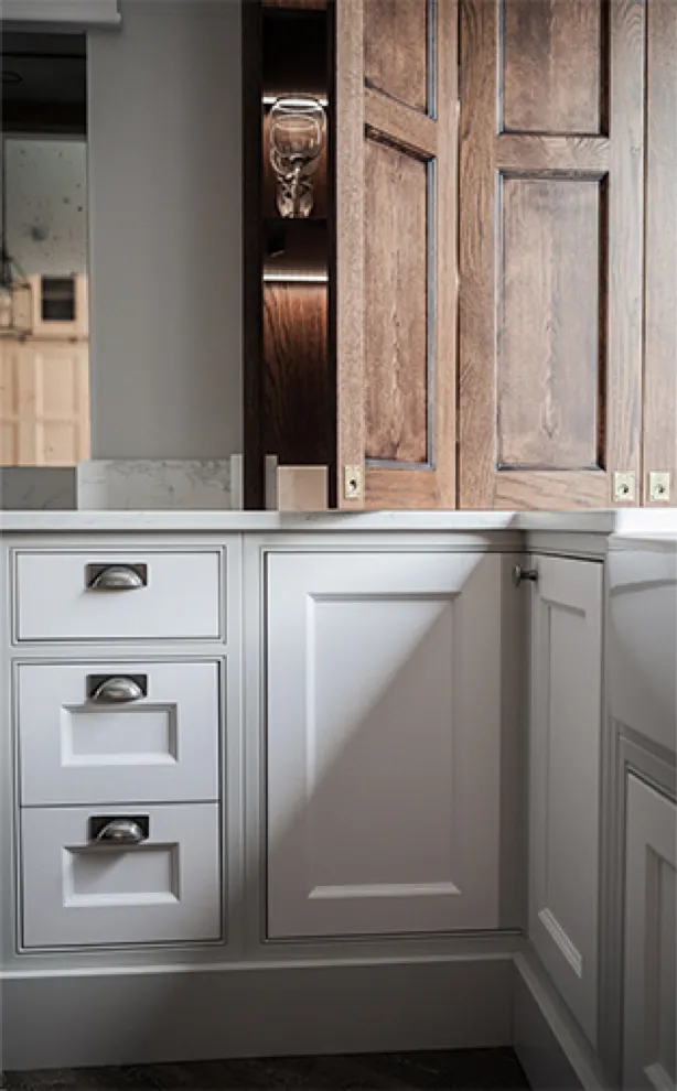 Painted inframe cabinets with cup handles and an oak dresser in the Newport showroom